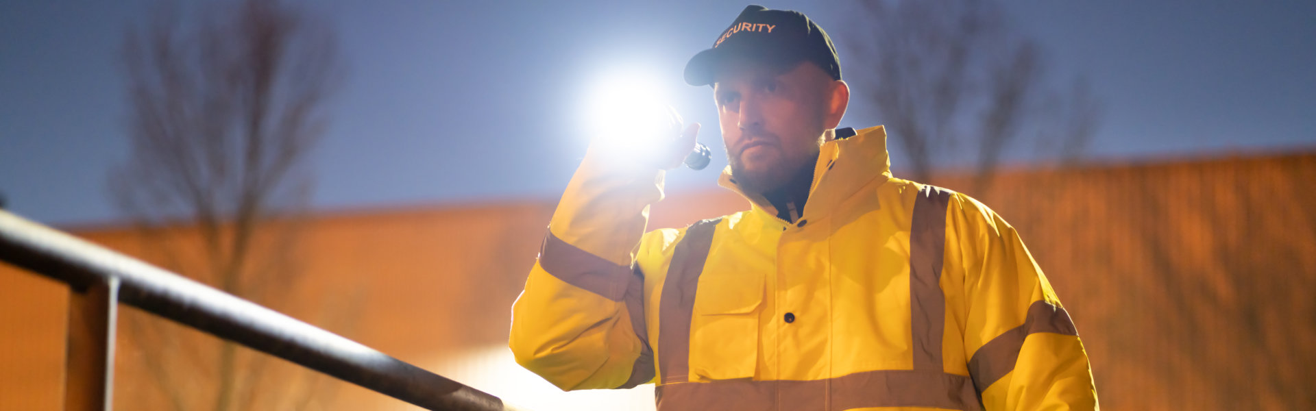 security checking the perimeter with a flashlight