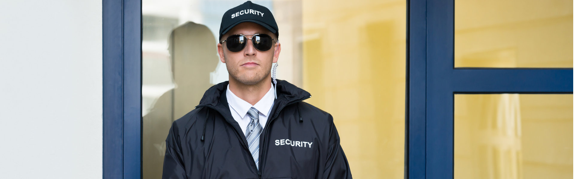 Security standing outside commercial building